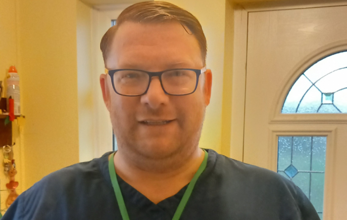 Jamie smiling at the camera