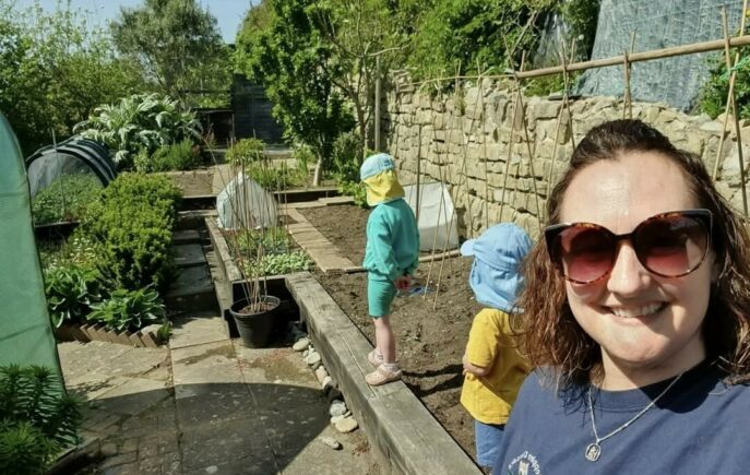 Sarah in her allotment